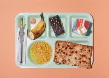 Colorful Lunch Break School Lunch on Green Cafeteria Tray Themes Shot Top Down Overhead View Peach Background