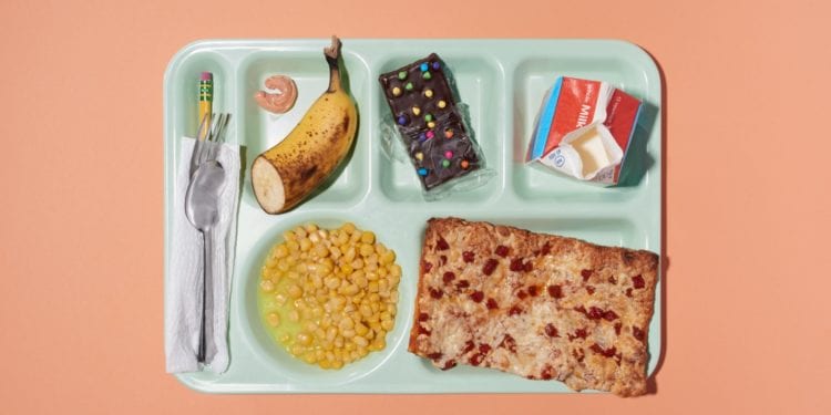 Colorful Lunch Break School Lunch on Green Cafeteria Tray Themes Shot Top Down Overhead View Peach Background