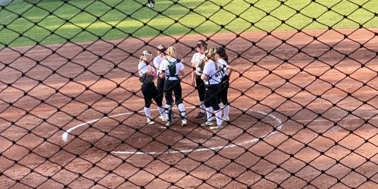 Wyoming East's infield huddles to discuss strategy during a 7-0 loss to Chapmanville Friday.