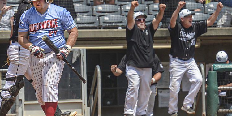Independence’s Hunter Schoolcraft returns to the dugout after the final out as North Marion celebrates their advancement to the AA state championship game on Friday in Charleston. (F. Brian Ferguson/Lootpress)
