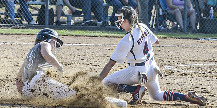 Wyoming East’s Lilly Hill, left, slides safely into second as Independence shortstop Alli Hypes waits for the throw during Monday action in Coal City. (F. Brian Ferguson/Lootpress)