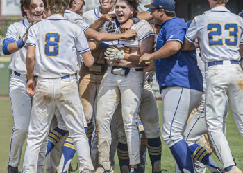 Logan’s Konner Lowe, center, is mobbed by his teammates after his game winning hit in the bottom of the 7th against Herbert Hoover. Logan will face North Marion on Saturday in the Class AA State Tournament in Charleston. (F. Brian Ferguson/Lootpress)