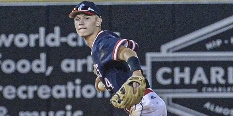 Man shortstop Caleb Blevins tracks down a ball deep in the hole and throws for the out against Charleston Catholic during Friday evening action at the Class A state tournament in Charleston. (F. Brian Ferguson/Lootpress)