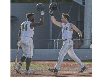 WV Miners Malik Williams, (left) taps helmets with Patrick Mills after Mills hit a towering home run during Tuesday evening action against Champion City. (F. Brian Ferguson/Lootpress)