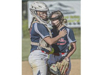 Independence catcher Kaylen Parks, left, talks with pitcher Delaney Buckland during Wednesday action in Coal City. (F. Brian Ferguson/Lootpress).