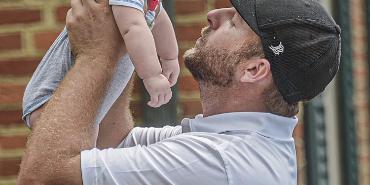 Sutton David Jude, left, has a face-to-face with his father Davey Jude, after Davey won the Mountain State Golf Classic on Monday at Glade Springs. (F. Brian Ferguson/Lootpress)