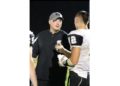 Westside head coach Tyler Dunigon (left) talks with a player during a game last season in Clear Fork. (Photo Credit: Jim Cook)