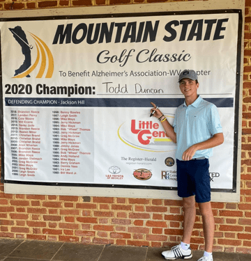 Todd Duncan, the defending Mountain State Golf Classic champion, writes his name after winning the event in 2020. (Submitted Photo)