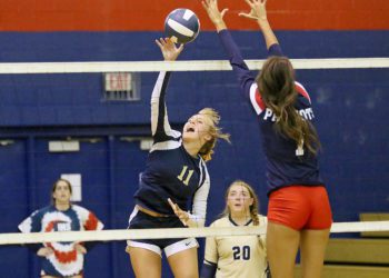 (Brad Davis/For LootPress) Greenbrier West's Kadie O'Dell attacks as Independence's Bella Acord  tries to block Thursday night in Coal City.