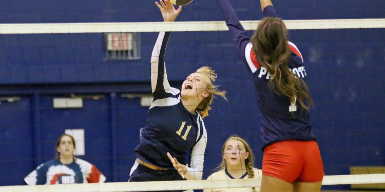 (Brad Davis/For LootPress) Greenbrier West's Kadie O'Dell attacks as Independence's Bella Acord  tries to block Thursday night in Coal City.