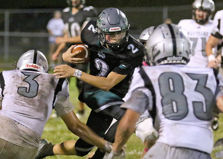 (Brad Davis/For LootPress) Wyoming East's Jackson Danielson dodges a tackle from Westside defender Jaxon Cogar last season in New Richmond.