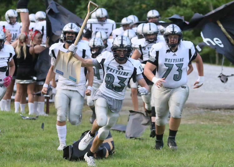 (Brad Davis/For LootPress) Westside takes the field for its annual battle with cross-county rival Wyoming East Friday night in New Richmond.