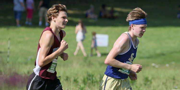 (Brad Davis/For LootPress) Shady Spring's Jacob Dowdy, right, and Woodrow Wilson's Aiden Kneeland stay locked together as they run in 1st and 2nd place during the duration of the high school boys portion of the Chick-Fil-A Invitational Aug.28 at Beckley-Stratton Middle School.