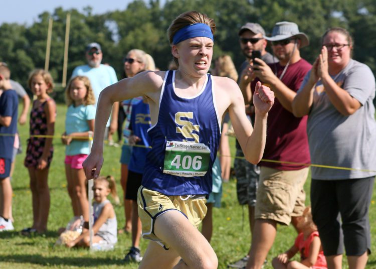 (Brad Davis/For LootPress) Shady Spring's Jacob Dowdy sprints to the finish to beat Woodrow Wilson's Aiden Kneeland for a narrow win during the high school boys portion of the Chick-Fil-A Invitational on Aug. 28 at Beckley-Stratton Middle School.