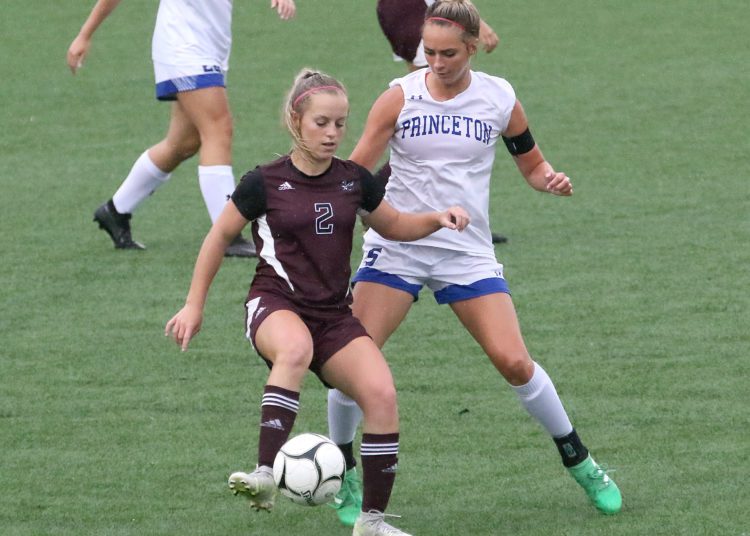 (Brad Davis/For LootPress) Woodrow Wilson's Abby Dillon battles for possession with Princeton's Lauren Parish Tuesday evening at the YMCA Paul Cline Memorial Sports Complex.