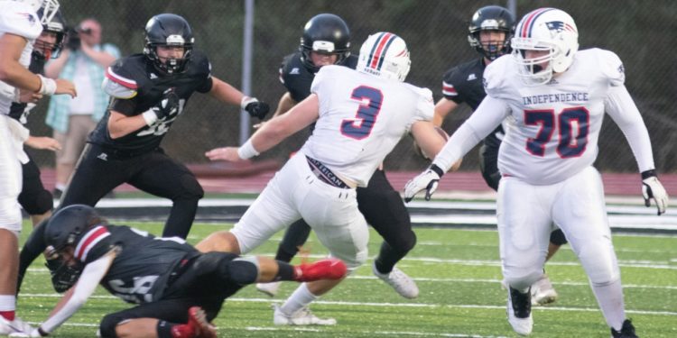 Independence's Atticus Goodson (3) jukes a defender during Friday's win over Liberty. (Heather Belcher/Lootpress)