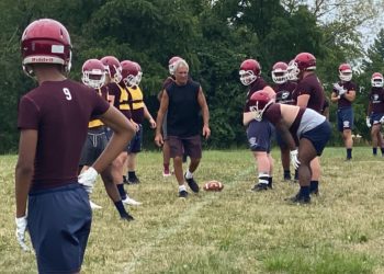 Bluefield head coach Fred Simon instructs his offensive line during a practice at Bluefield High School.
