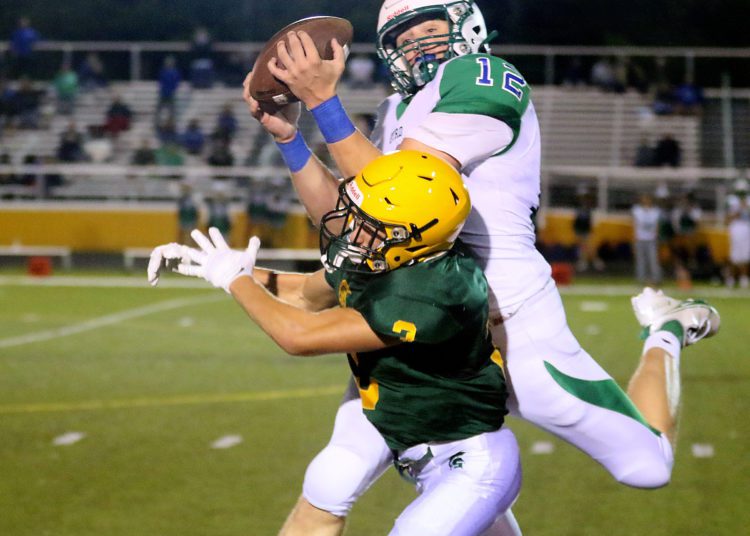 (Brad Davis/For LootPress) Robert C. Byrd's Nathaniel Junkins intercepts a pass intended for Greenbrier East receiver Bryson Ormsbee Friday night in Fairlea.