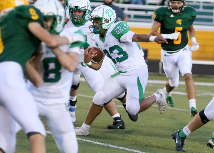 (Brad Davis/For LootPress) Robert C. Byrd's Jeremiah King rumbles through the Greenbrier East defense Sept. 11 in Fairlea.