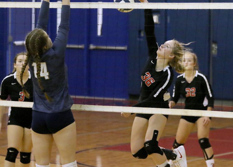 (Brad Davis/For LootPress) Liberty's Josie Hartshorn attacks as Nicholas County's Lillie Bell tries to block during a tri-match hosted by Independence Wednesday night in Coal City.