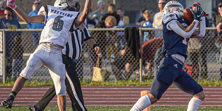 Independence receiver Trey Bowers halls in a long TD pass over the head of Westside’s Dante Lowe during Tuesday action in Coal City. (F. Brian Ferguson/Lootpress)