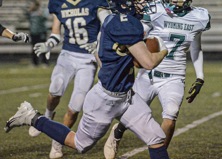 Nichols County’s Coltin Browning picks up yards against Wyoming East during Friday evening action in Summersville. (F. Brian Ferguson/Lootpress).