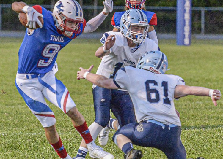 Midland Trail’s Cody Harrell snakes past a tackle against Meadow Bridge during Friday action in Hico. (F. Brian Ferguson/Lootpress).