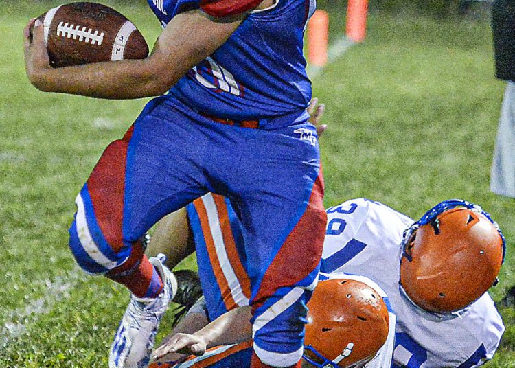 Midland Trail QB Josh Dickerson picks up some ground yards during Friday evening action in Hico. (F. Brian Ferguson/Lootpress).