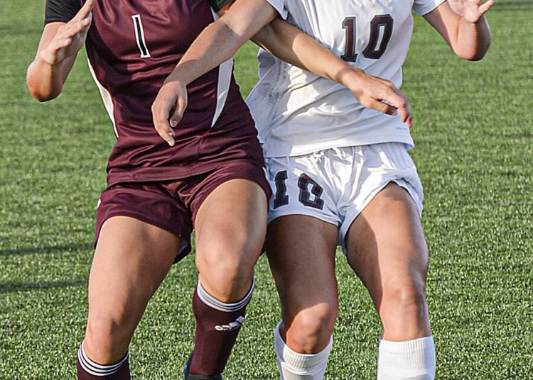 Woodrow Wilson’s Mya Wooton,, left, and George Washington’s Ava Tretheway fight for the ball during Thursday action in Beckley. (F. Brian Ferguson/Lootpress)