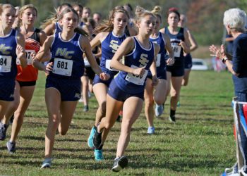 (Brad Davis/For LootPress) Shady Spring's Charlotte McGinnis leads the field around the first bend as the high school girls portion of an event at Twin Falls State Park gets underway Wednesday afternoon.