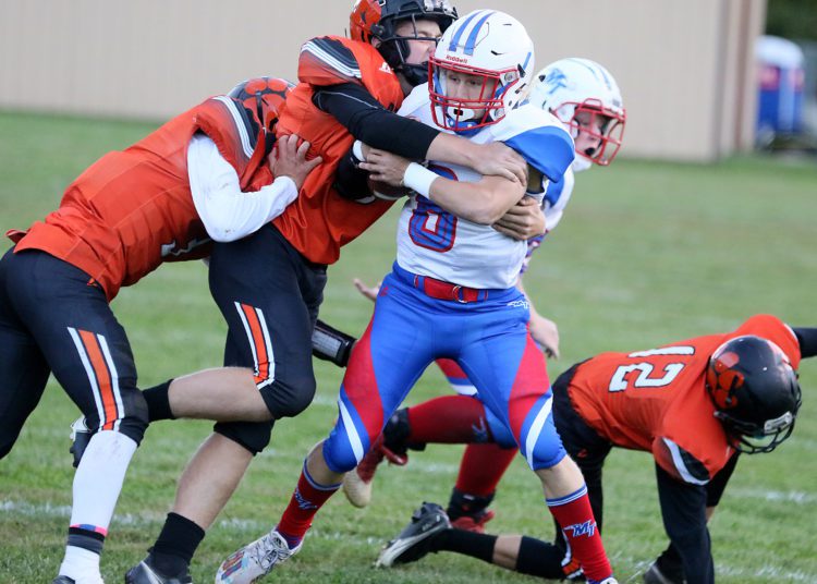 (Brad Davis/For LootPress) Midland Trail's Robert Ruffner carries the ball against Summers County Monday night in Hinton.