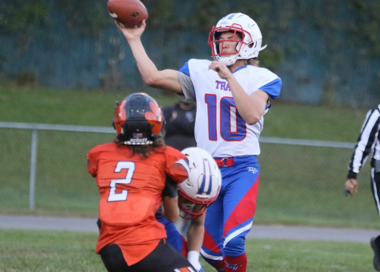(Brad Davis/For LootPress) Midland Trail quarterback Joshua Dickerson throws a pass against Summers County Monday night in Hinton.