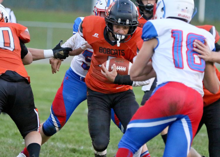 (Brad Davis/For LootPress) Summers County's Willie Dodson carries the ball against Midland Trail Monday night in Hinton.