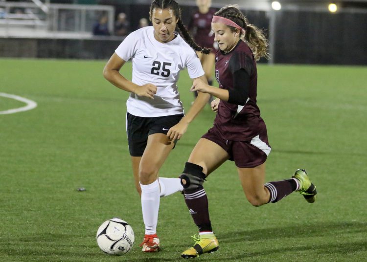 (Brad Davis/For LootPress) Woodrow Wilson's Meredith Hall battles for possession with Oak Hill's Samiah Lynch Thursday night in Beckley.