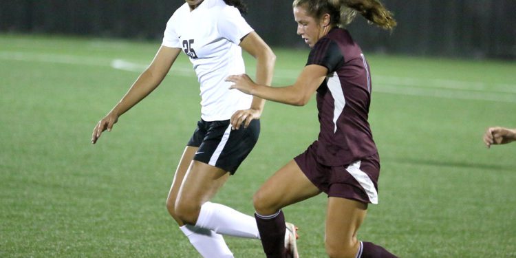 (Brad Davis/For LootPress) Woodrow Wilson's Mya Wooton battles for possession with Oak Hill's Samiah Lynch Oct. 22 in Beckley.