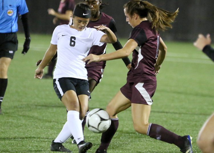 (Brad Davis/For LootPress) Oak Hill's Hannah White battles for possession with Woodrow Wilson's Mya Wooton Thursday night in Beckley.