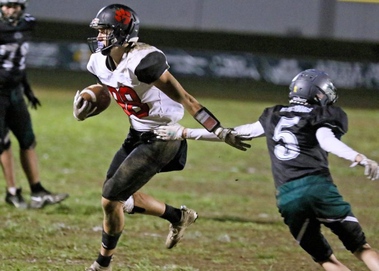 (Brad Davis/For LootPress) PikeView receiver Dylan Blake avoids a tackle attempt from Wyoming East's Isaiah Tilley after making a catch for what would be his 2nd touchdown of the game Friday night in New Richmond.