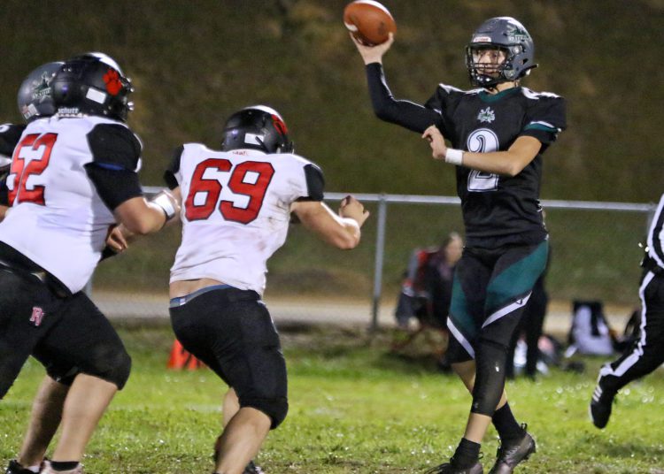 (Brad Davis/For LootPress) Wyoming East quarterback Jackson Danielson throws a short pass as PikeView defenders converge on him Friday night in New Richmond.