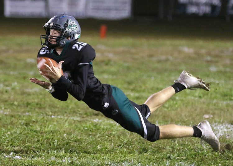 (Brad Davis/For LootPress) Wyoming East's Tucker Cook dives to make a catch against PikeView Friday night in New Richmond.