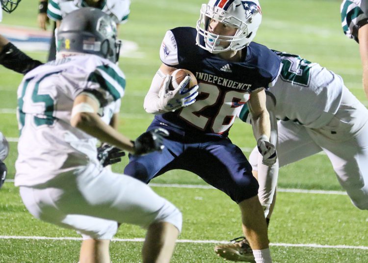 (Brad Davis/For LootPress) Independence's Tyler LInkswiler carries the ball against Wyoming East Friday night in Coal City.