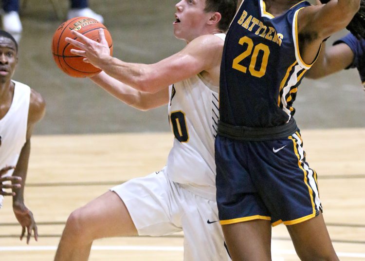 (Brad Davis/For LootPress) WVU Tech's Philip Mullins drives to the basket as Alderson Broaddus' Tahleik Walker defends Friday night at the Beckley-Raleigh County Convention Center.