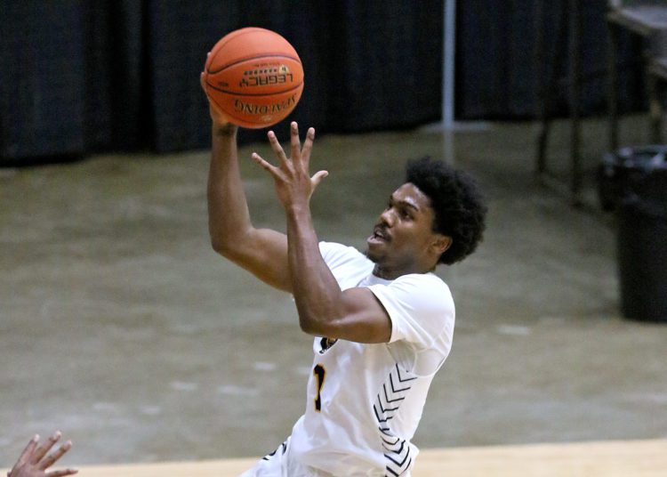 (Brad Davis/For LootPress) WVU Tech's Andrew Work drives to the basket as Alderson Broaddus' Tahleik Walker defends Friday night at the Beckley-Raleigh County Convention Center.