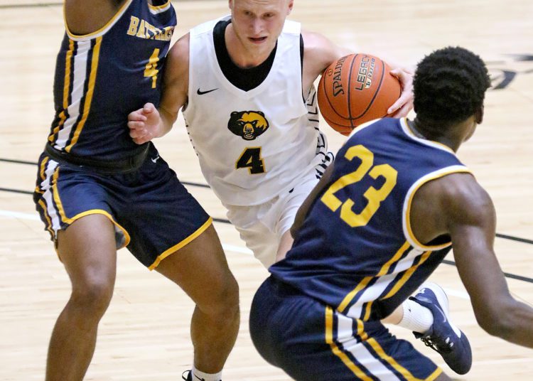 (Brad Davis/For LootPress) WVU Tech's Andreas Jonsson drives to the basket between Alderson Broaddus' Coryon Rice, left, and Eman Eman Friday night at the Beckley-Raleigh County Convention Center.