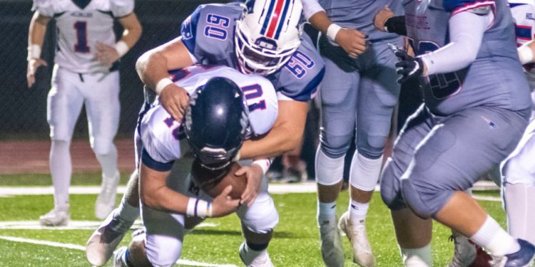 File Photo - Man's Israel Canterbury carries the ball during a game against Independence on Oct. 15.
(Heather Belcher/Lootpress)