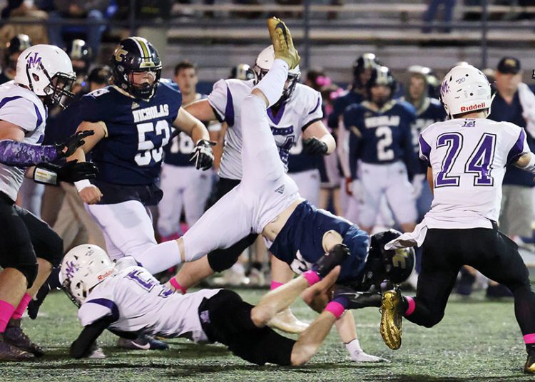 James Monroe’s (5) tackles Nicholas County’s (10) during the first quarter of their football game in Summersville on Friday, Oct. 29, 2021 (Photo by Chris Jackson)