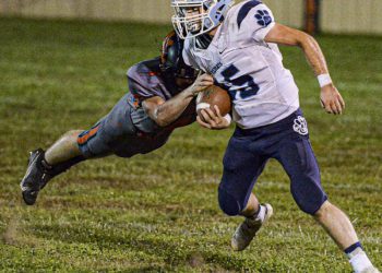 File Photo - Meadow Bridge’s James McClure picks up yards against Summers County during action in Hinton on Oct. 16. (F. Brian Ferguson/Lootpress).