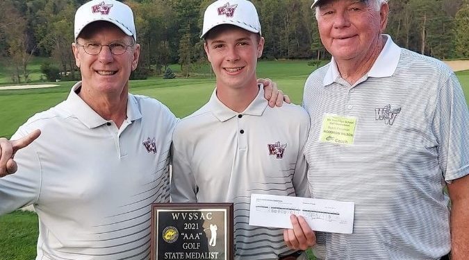 Beckley's Zan Hill (center) posses with his scorecard as well as Charlie Houck (left) and Beckley golf coach Butch Freeman (right)