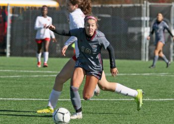 (Brad Davis/For LootPress) George Washington's Ava Tretheway gets past Spring Mills' Chelsea Mcintosh during State Soccer Tournament action Friday morning in Beckley.