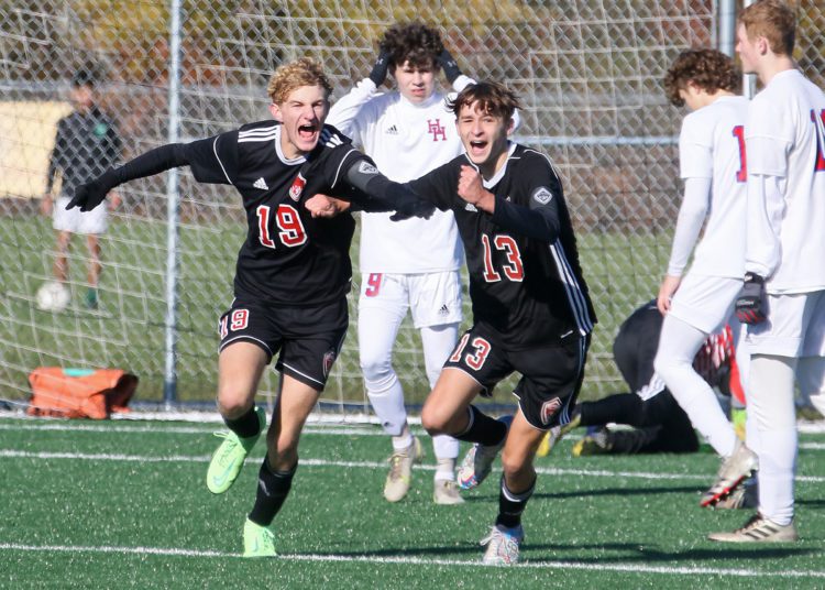 (Brad Davis/For LootPress) Point Pleasant's Colton Young, left, and Ian Wood react after scoring a goal against Herbert Hoover during State Soccer Tournament action Friday morning in Beckley.