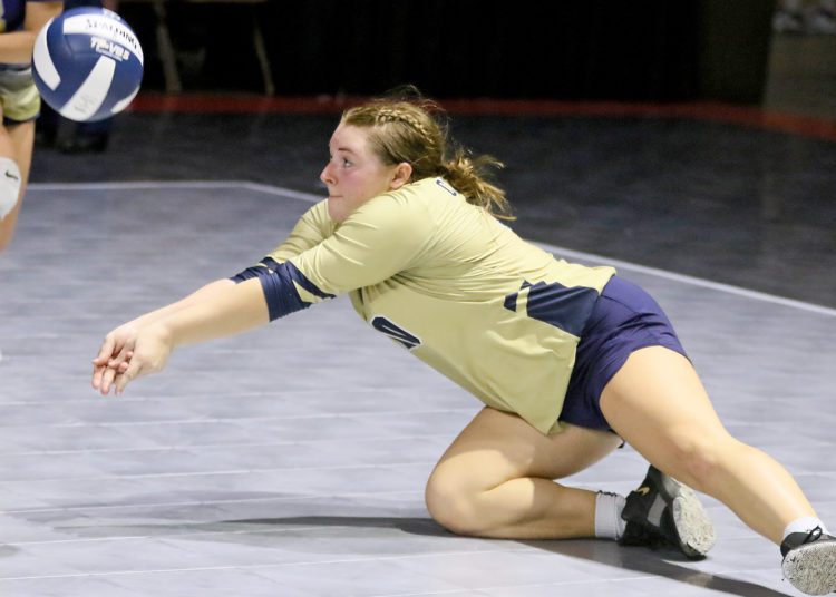 (Brad Davis/For LootPress) Greenbrier West's Natalie Agee dives to make a dig during the Cavaliers' first round matchup against Gilmer at the State High School Volleyball Tournament Friday morning at the Charleston Civic Center.